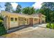 Back of home featuring brick accents, double french doors, and a concrete patio at 7121 Forest Se Dr, Covington, GA 30014