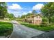 Back of home featuring brick chimney, fenced yard, and nice driveway at 7121 Forest Se Dr, Covington, GA 30014