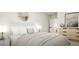 Comfortable bedroom with neutral tones, decorative mirror, and soft natural lighting at 1212 Trombone Way # 107, Mcdonough, GA 30252