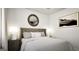 Serene bedroom featuring a plush bed, round mirror, and modern artwork at 1212 Trombone Way # 107, Mcdonough, GA 30252