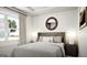 Bright bedroom with a large window, plush bed, and stylish decor at 1212 Trombone Way # 107, Mcdonough, GA 30252