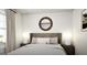 Inviting bedroom with a comfortable bed, round mirror, and soft, natural light at 1212 Trombone Way # 107, Mcdonough, GA 30252