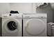 A convenient laundry area equipped with modern washer and dryer units at 1212 Trombone Way # 107, Mcdonough, GA 30252