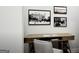Cozy home office space with a wooden desk, chair, and decorative artwork on the walls at 1212 Trombone Way # 107, Mcdonough, GA 30252
