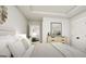 Bright bedroom with a dresser, a stylish lamp, and a decorative mirror at 100 Trombone Way, Mcdonough, GA 30252