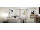 Cozy living room with white sofas, a window, and stylish decor at 100 Trombone Way, Mcdonough, GA 30252