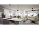 Open-concept living space with kitchen island, dining area, and inviting living room at 100 Trombone Way, Mcdonough, GA 30252