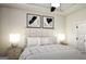 Comfortable bedroom with a luxurious bed, stylish decor, and soft lighting at 100 Trombone Way, Mcdonough, GA 30252