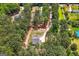 Birds eye view showcases a tree lined driveway leading to a newly constructed house at 1547 South Bethany Rd, Locust Grove, GA 30248