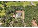 Aerial view of a secluded home surrounded by dense trees and landscaping at 1547 South Bethany Rd, Locust Grove, GA 30248