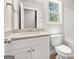 Bathroom with stylish vanity, granite countertop, and modern fixtures at 1547 South Bethany Rd, Locust Grove, GA 30248
