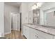 Bathroom features double sinks with granite countertops and a shower behind glass doors at 1547 South Bethany Rd, Locust Grove, GA 30248