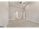 Empty bedroom features neutral carpet, high ceilings, and a view of the en-suite bathroom at 1547 South Bethany Rd, Locust Grove, GA 30248