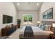 Virtually staged bedroom with natural light, a dresser, and a bed at 1547 South Bethany Rd, Locust Grove, GA 30248