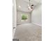 Spacious bedroom features neutral carpet, vaulted ceiling, and natural light from a large window at 1547 South Bethany Rd, Locust Grove, GA 30248