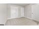 This bedroom features plush carpet and closet doors for ample storage space at 1547 South Bethany Rd, Locust Grove, GA 30248