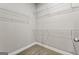 Walk-in closet with carpet flooring and wire shelves, providing ample storage at 1547 South Bethany Rd, Locust Grove, GA 30248