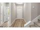 Clean foyer with light grey walls, wood flooring, and stairs to the right of the image at 1547 South Bethany Rd, Locust Grove, GA 30248
