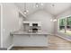 Kitchen featuring granite counters, stainless appliances, bright lighting, and vaulted ceilings at 1547 South Bethany Rd, Locust Grove, GA 30248