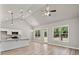 Open living area with vaulted ceilings, recessed lighting, and a ceiling fan at 1547 South Bethany Rd, Locust Grove, GA 30248