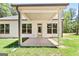 Covered patio with a concrete slab, perfect for outdoor seating and entertaining at 1547 South Bethany Rd, Locust Grove, GA 30248