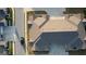 Aerial view of townhome complex with attached garages, ample parking, and well-maintained roofs at 2929 Rambler Dr, Loganville, GA 30052