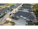 Aerial view showcases modern townhomes with attached garages, ample parking, and landscaped surroundings at 2929 Rambler Dr, Loganville, GA 30052