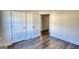 Bedroom features hardwood floors, white trim, white walls, and two doors at 2929 Rambler Dr, Loganville, GA 30052
