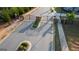 View from above the community entrance with stone pillars, gate, and landscaped median at 2929 Rambler Dr, Loganville, GA 30052