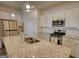 Modern kitchen featuring granite counters, a stainless steel appliance suite, and bright lighting at 2929 Rambler Dr, Loganville, GA 30052