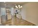 Open kitchen with stainless steel appliances, granite countertops, and white cabinetry at 2929 Rambler Dr, Loganville, GA 30052