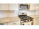 Close up on stainless steel appliances and granite countertops in a modern kitchen at 2929 Rambler Dr, Loganville, GA 30052