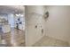 Well-lit laundry room with a shelf and view of the kitchen with appliances at 2929 Rambler Dr, Loganville, GA 30052