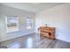 Light-filled room with hardwood floors, bright natural light and an upright piano at 2929 Rambler Dr, Loganville, GA 30052