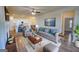 Cozy living room features a fireplace, plush seating, and adjacent, bright eat-in kitchen at 2929 Rambler Dr, Loganville, GA 30052