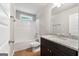 Bathroom with a single-sink vanity, a white toilet, and a white tub-shower combo at 1555 South Bethany Rd, Locust Grove, GA 30248