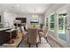 Elegant dining area is open to the kitchen, featuring a table for six, views to the backyard, and bar seating at 1555 South Bethany Rd, Locust Grove, GA 30248