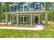 Inviting two-story home featuring a covered porch, manicured lawn and stylish black shutters at 1555 South Bethany Rd, Locust Grove, GA 30248