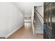 Spacious foyer with hardwood floors, staircase, and open view to living area at 1555 South Bethany Rd, Locust Grove, GA 30248