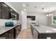 Spacious kitchen with granite counters, a large island, stainless steel appliances, and ample cabinet space at 1555 South Bethany Rd, Locust Grove, GA 30248