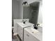 Bathroom with double vanity, light gray cabinets, white countertop, and shower at 2200 Hickory Station Cir, Snellville, GA 30078