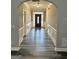 Welcoming foyer with hardwood floors, arched entryway, and decorative wainscoting at 2200 Hickory Station Cir, Snellville, GA 30078