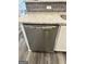 Stainless steel dishwasher with white cabinetry in a remodeled kitchen at 2200 Hickory Station Cir, Snellville, GA 30078