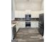 Modern kitchen with white cabinets, granite countertops, stainless steel appliances, and stylish backsplash at 2200 Hickory Station Cir, Snellville, GA 30078