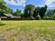 Large backyard with a privacy fence providing ample outdoor space and seclusion at 1681 Stanton Sw Rd, Atlanta, GA 30311