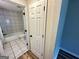 Bathroom featuring tiled floors, a shower and tub combination and neutral paint at 1681 Stanton Sw Rd, Atlanta, GA 30311