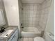 Bathroom featuring tiled shower and floors with a granite vanity at 1681 Stanton Sw Rd, Atlanta, GA 30311
