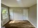 Bedroom with wood flooring, a window, two doors, and neutral wall paint at 1681 Stanton Sw Rd, Atlanta, GA 30311