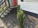 Close-up of the front porch featuring stairs and small, decorative bushes at 1681 Stanton Sw Rd, Atlanta, GA 30311