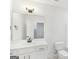 Well-lit bathroom featuring modern vanity, framed mirror, and updated fixtures at 3278 Greenhill Dr, Villa Rica, GA 30180